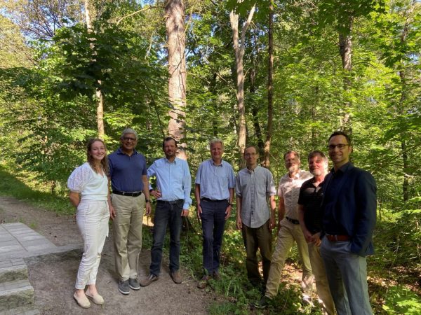 Group of scientists standing in the woods